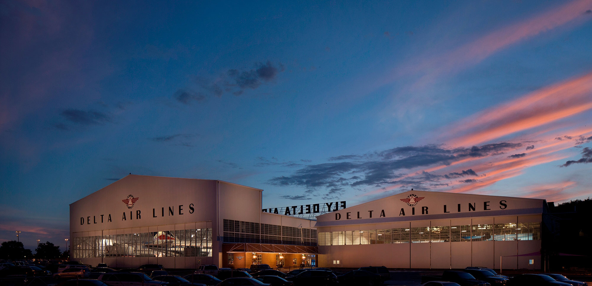 Exterior of the Delta Flight Museum at dusk in Atlanta, Georgia