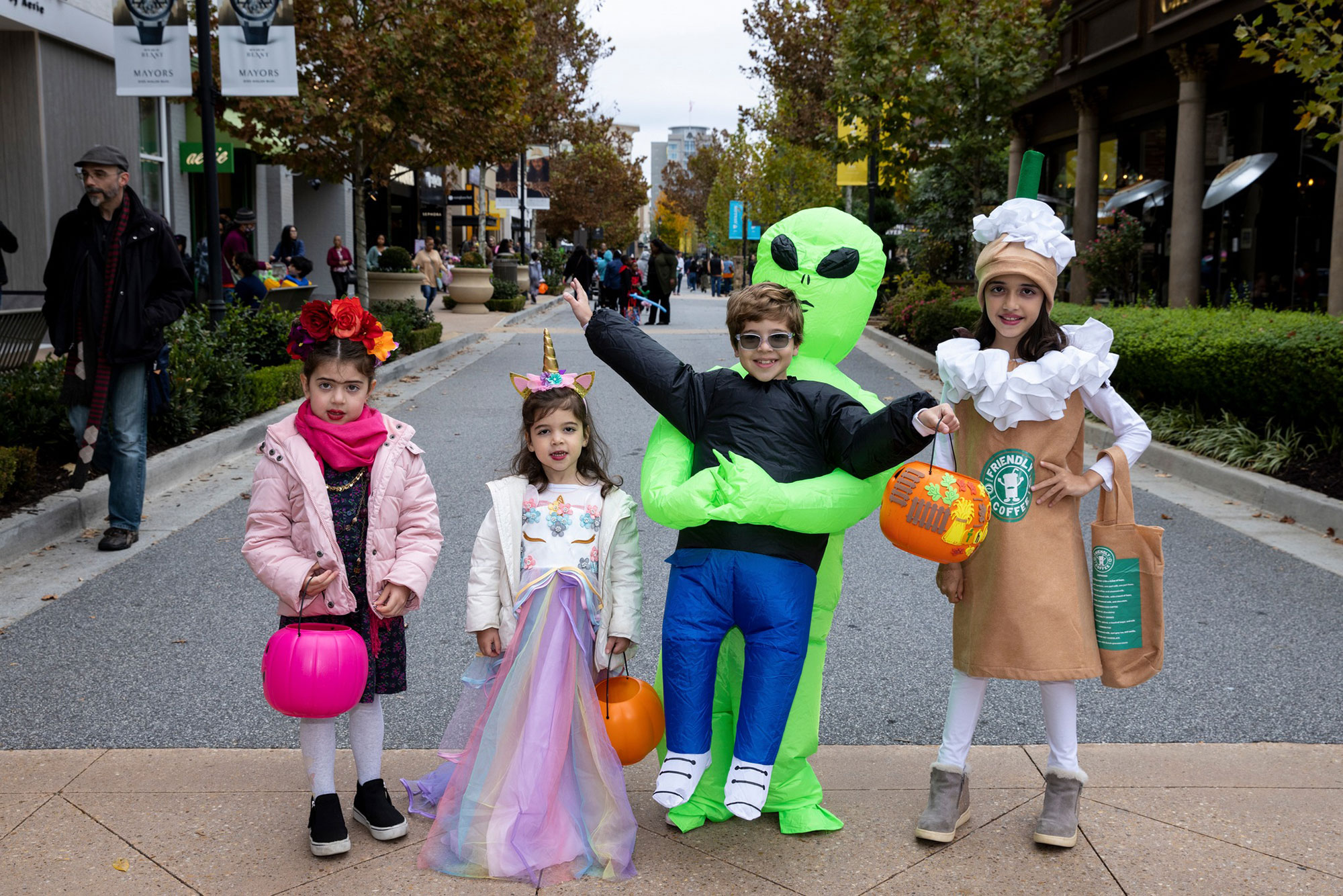kids dressed in Halloween costumes at Avalon in Alpharetta, Georgia