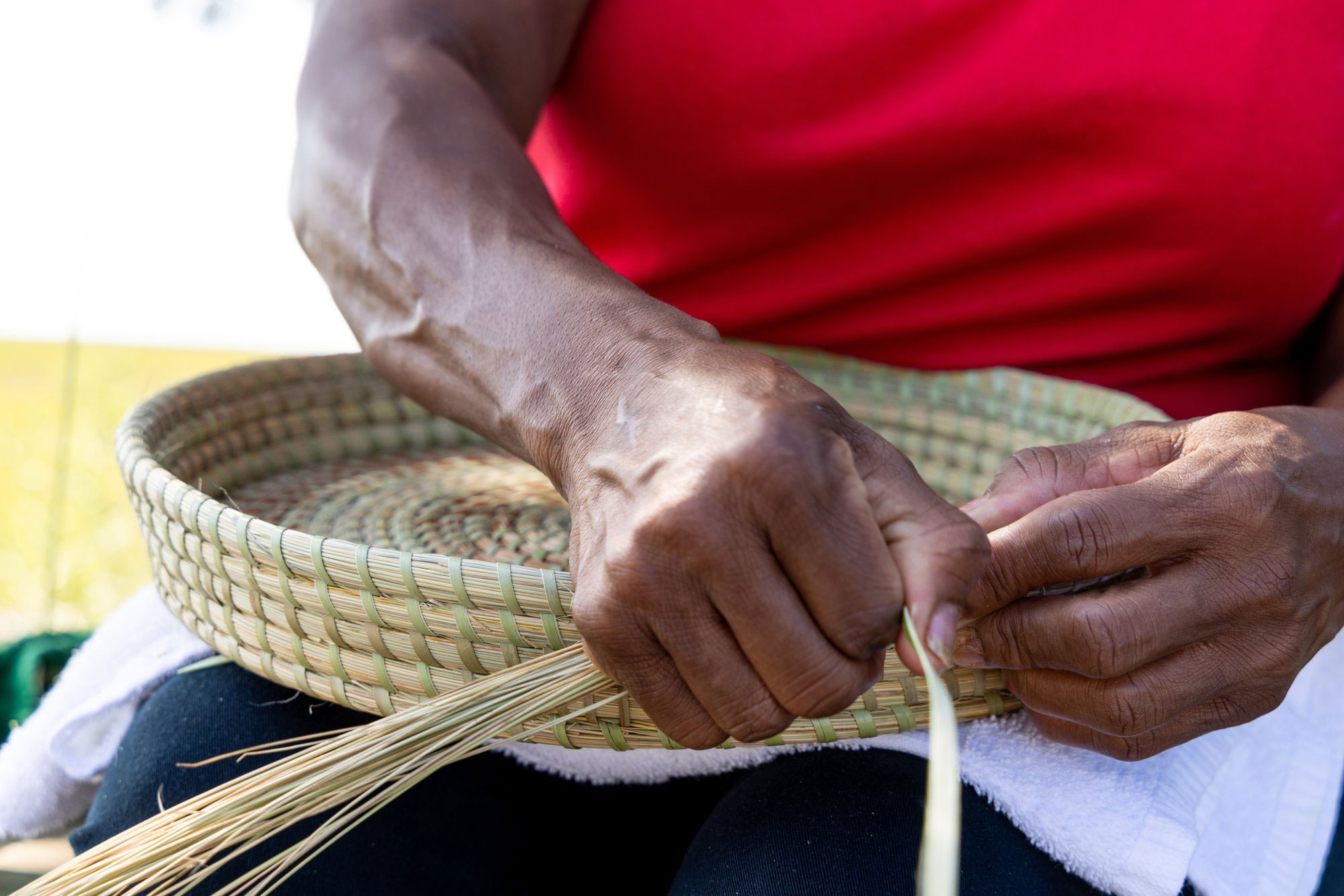 Woman weaving a basket on Sapelo Island, Georgia