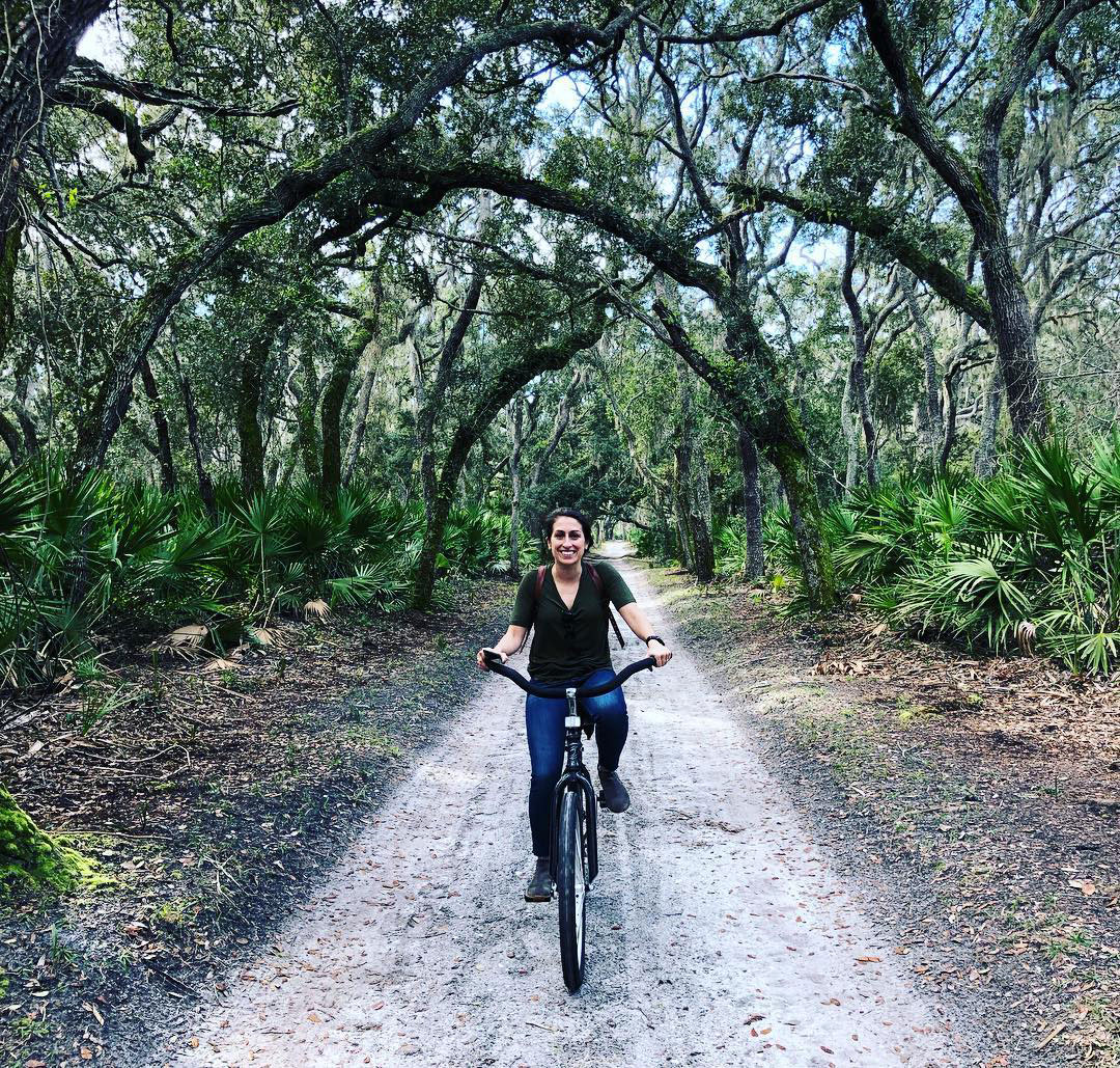 Woman biking on Cumberland Island, Georgia