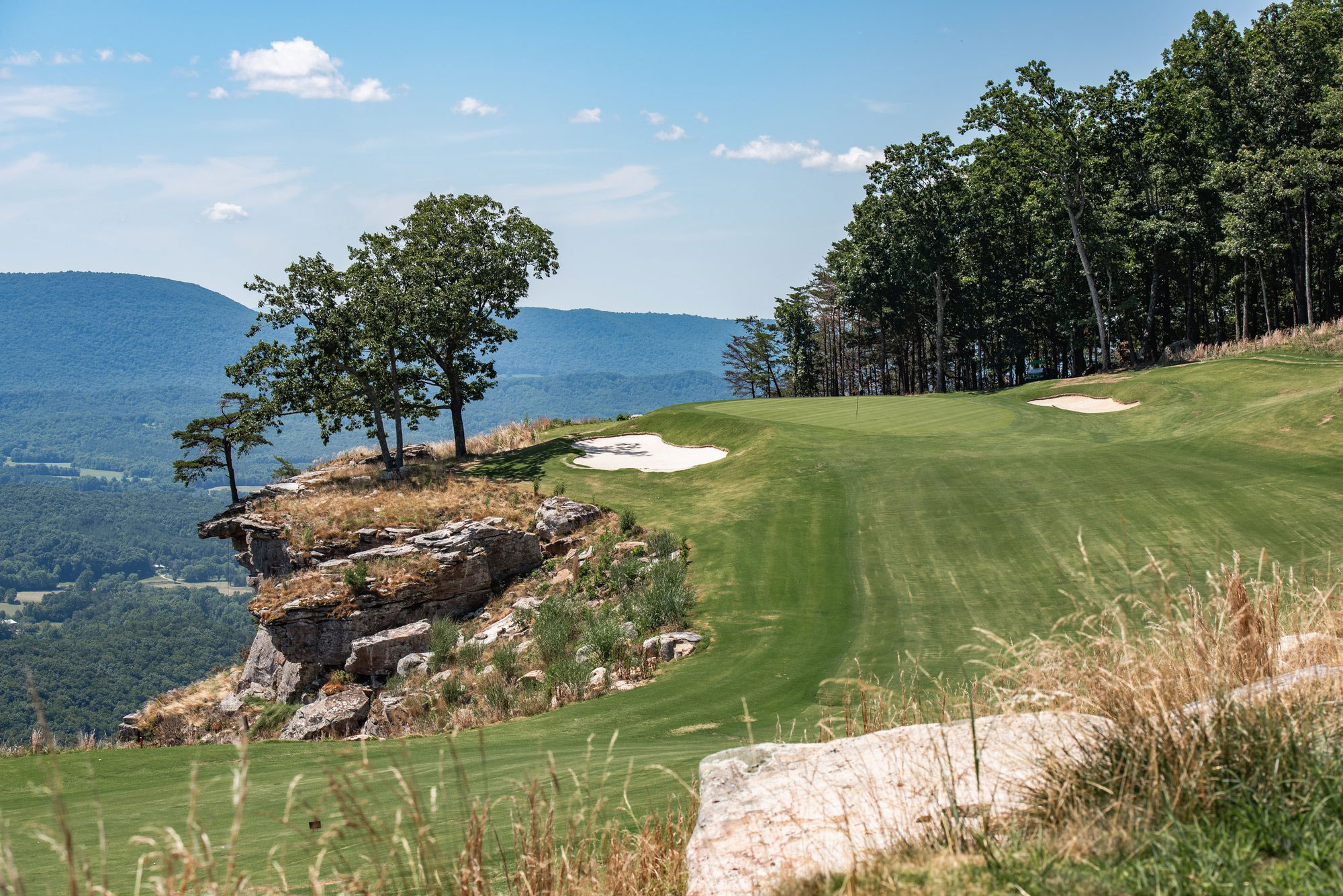 Scenic view of a cliff-side golf course at Cloudland at McLemore Resort