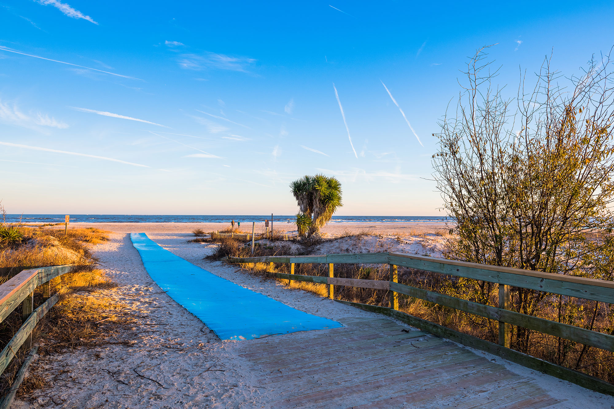 Blue mats extend onto the sand at Coast Guard Beach on St. Simons Island, Georgia