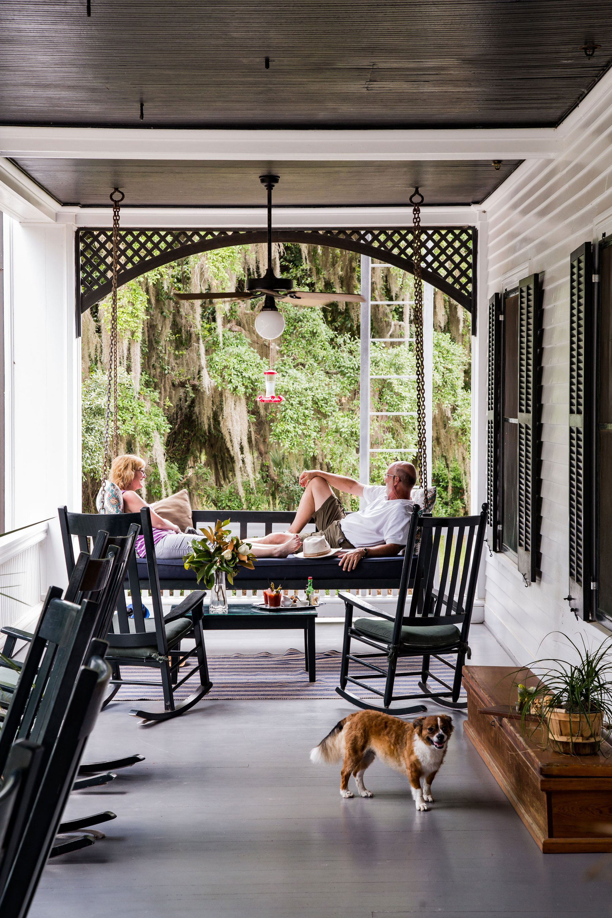 Couple relaxing on the porch at Greyfield Inn on Cumberland Island, Georgia