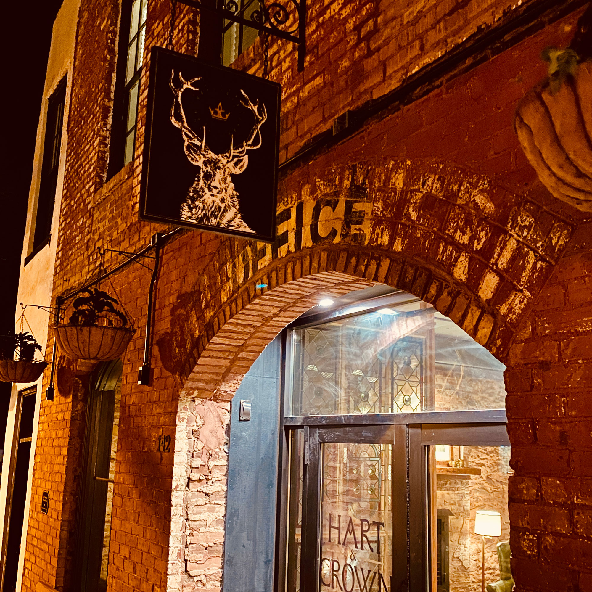 Exterior and sign at the Hart & Crown Tavern in Madison, Georgia