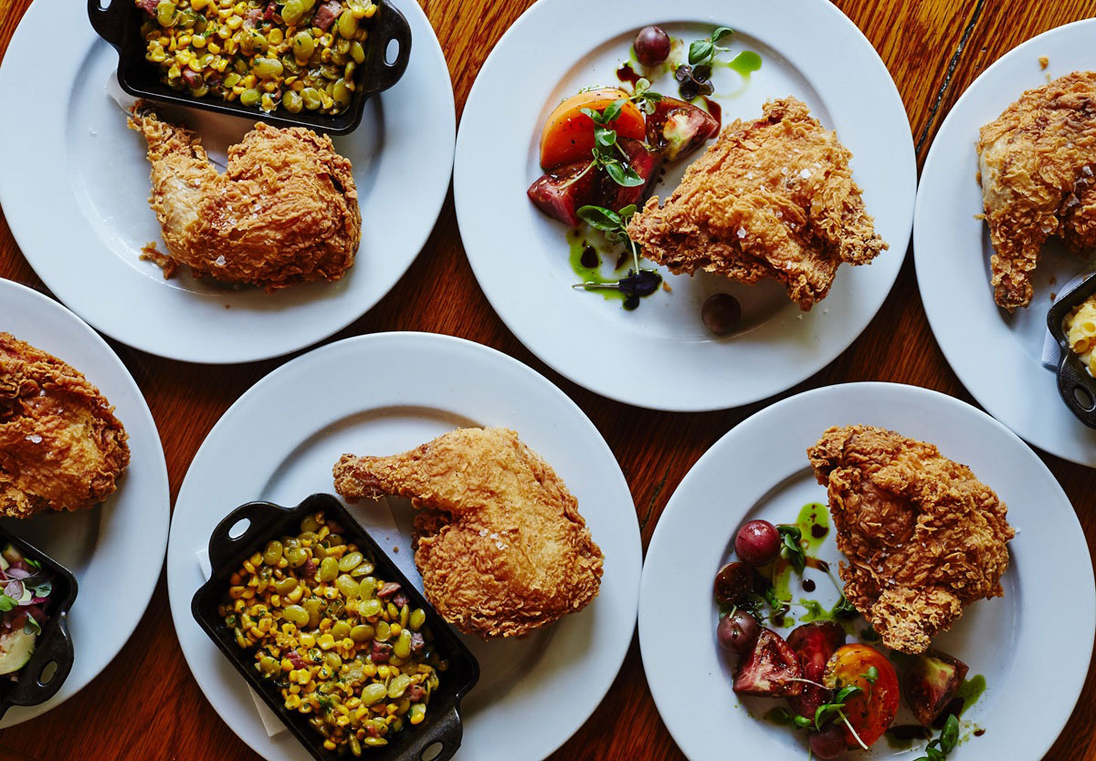 Plates of fried chicken and sides at Table and Main in Roswell, Georgia
