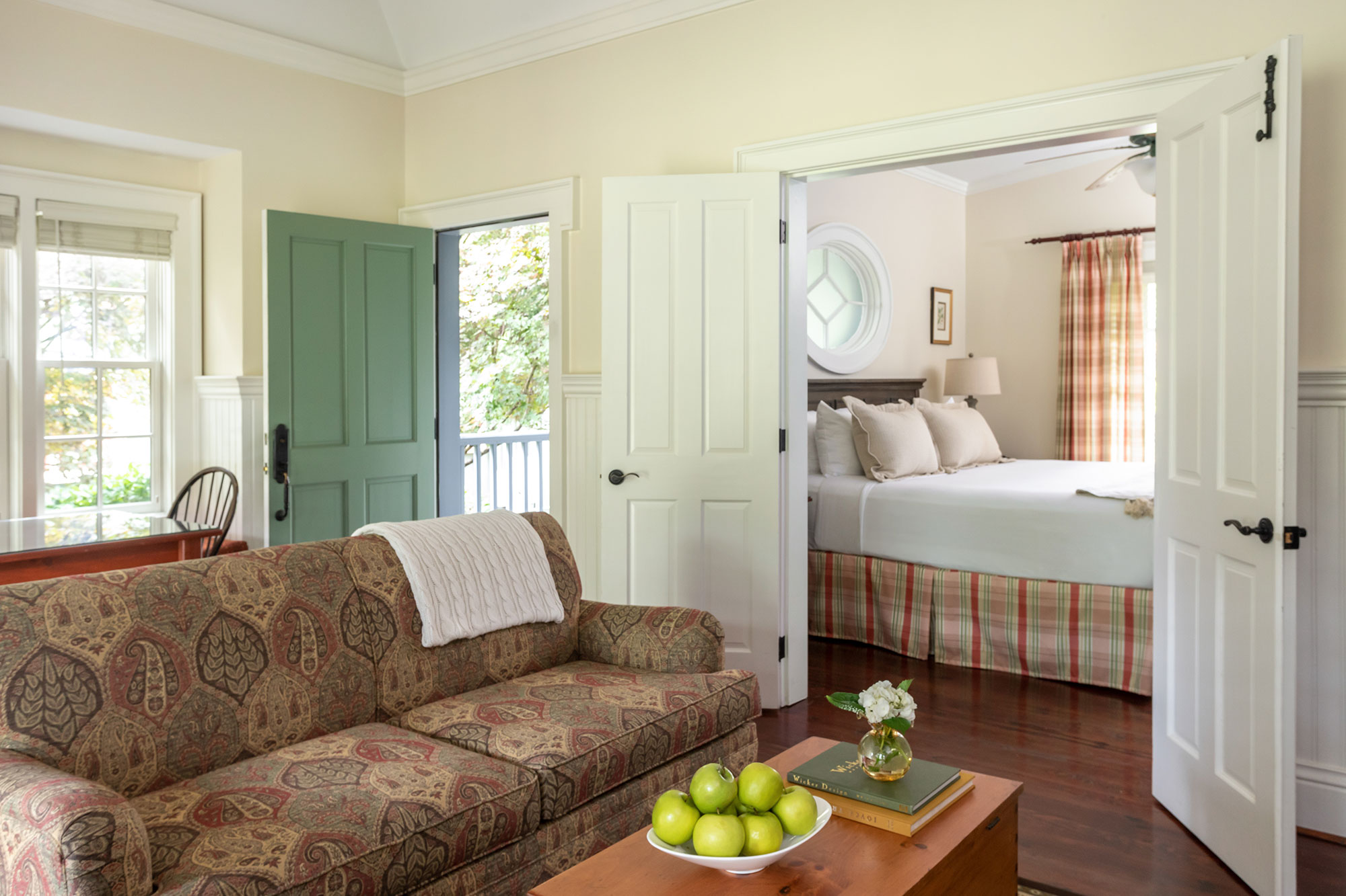 Sofa and view into a bedroom in the Garden and Meadow Suite at Barnsley Resort