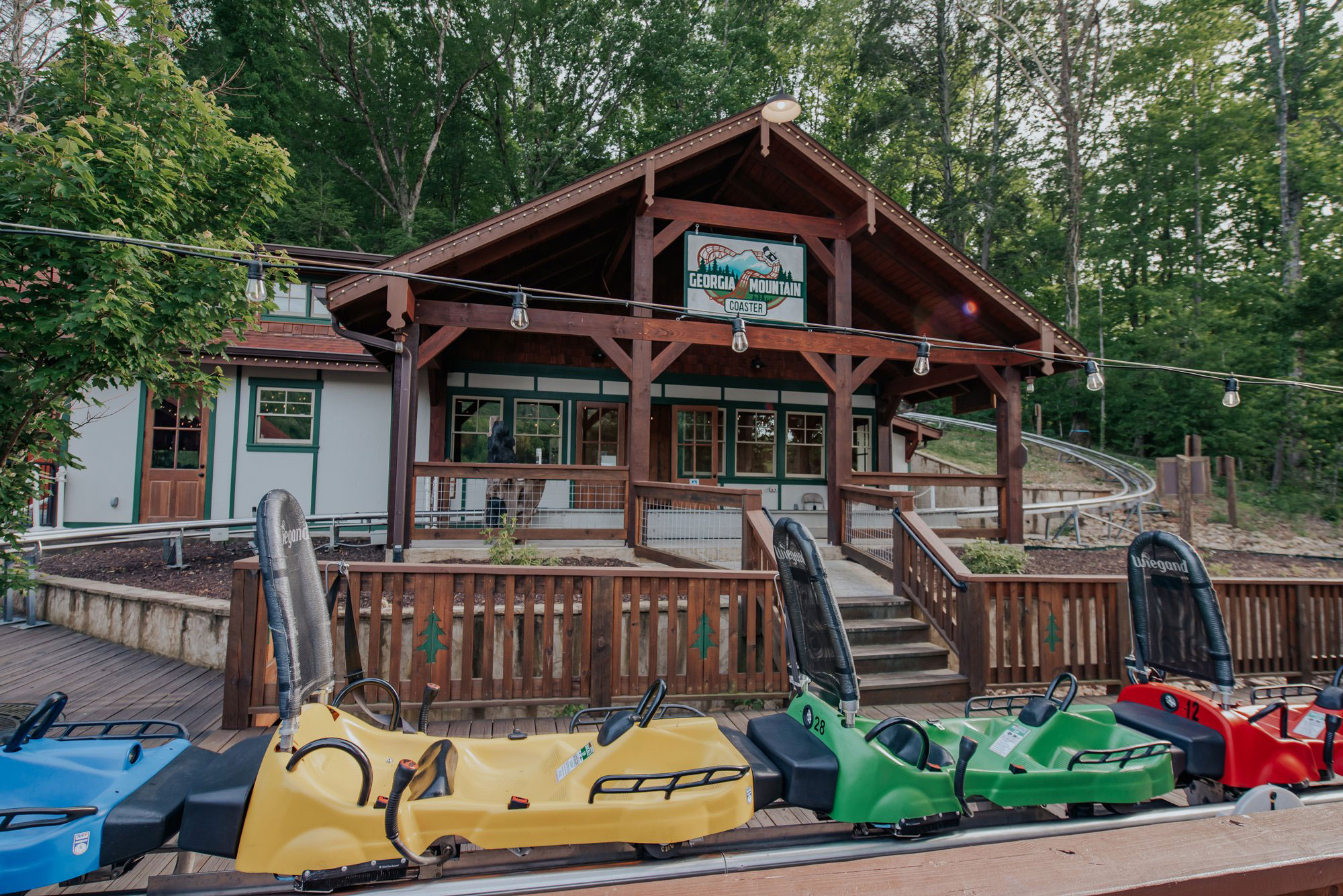 Colorful carts parked in front of Georgia Mountain Coaster in Helen, Georgia