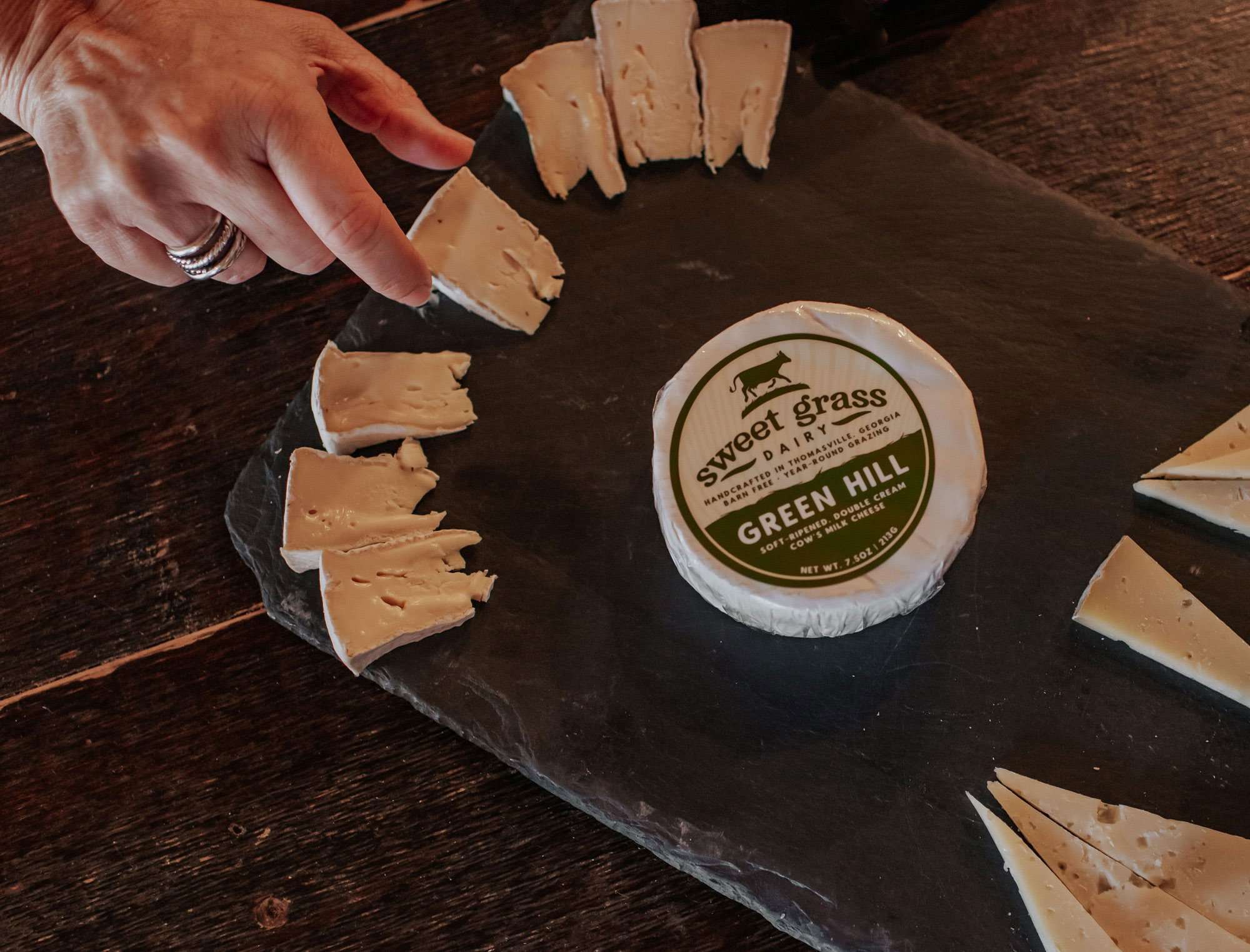 Platter of Green Hill cheese slices from Sweet Grass Dairy in Thomasville, Georgia