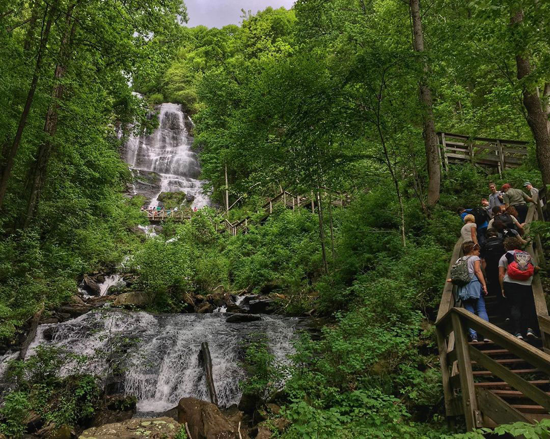 People hiking up the stairs alongside Amicalola Falls in Dawsonville, Georgia