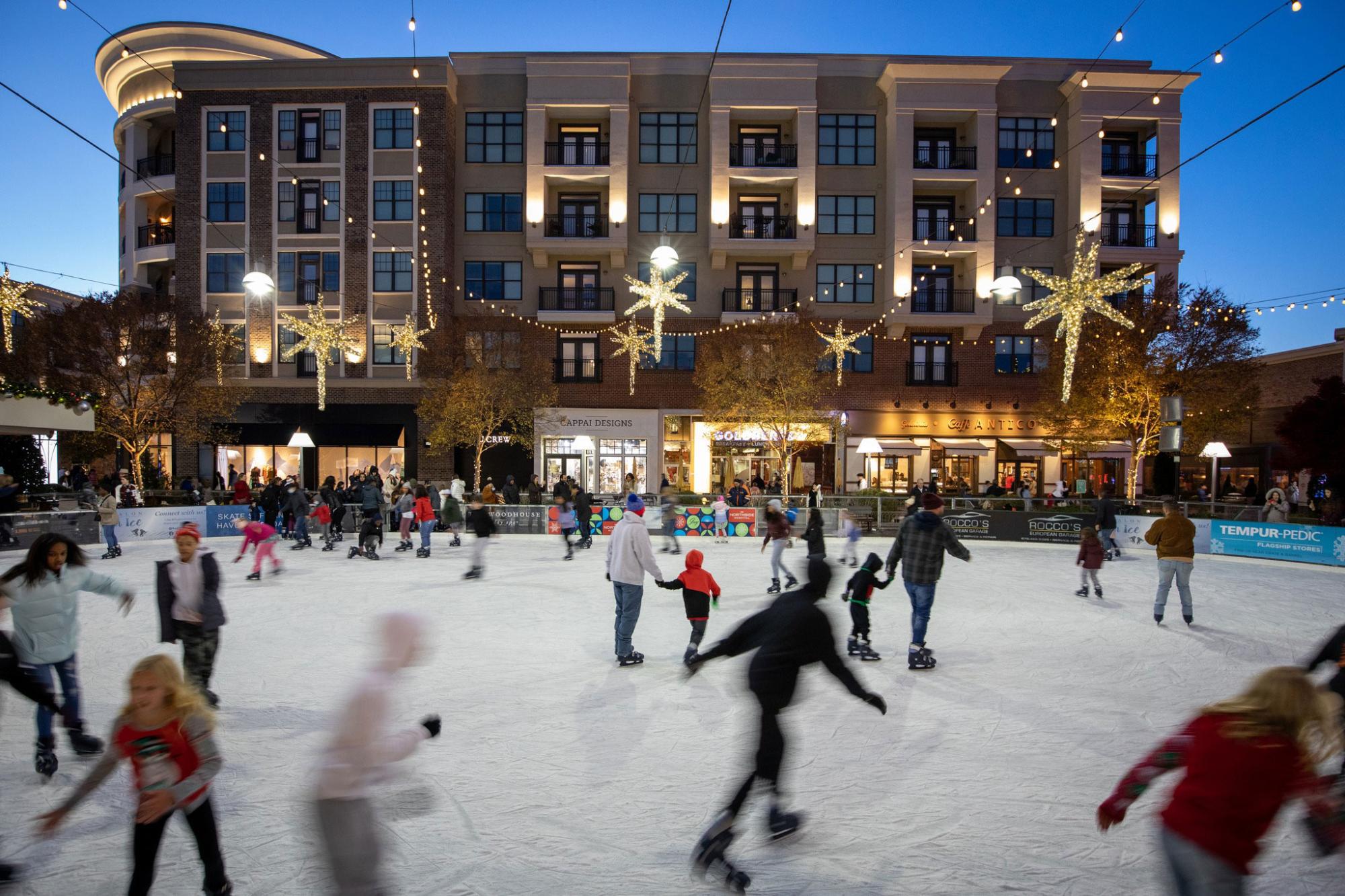 People ice skating on the rink at Avalon in Alpharetta