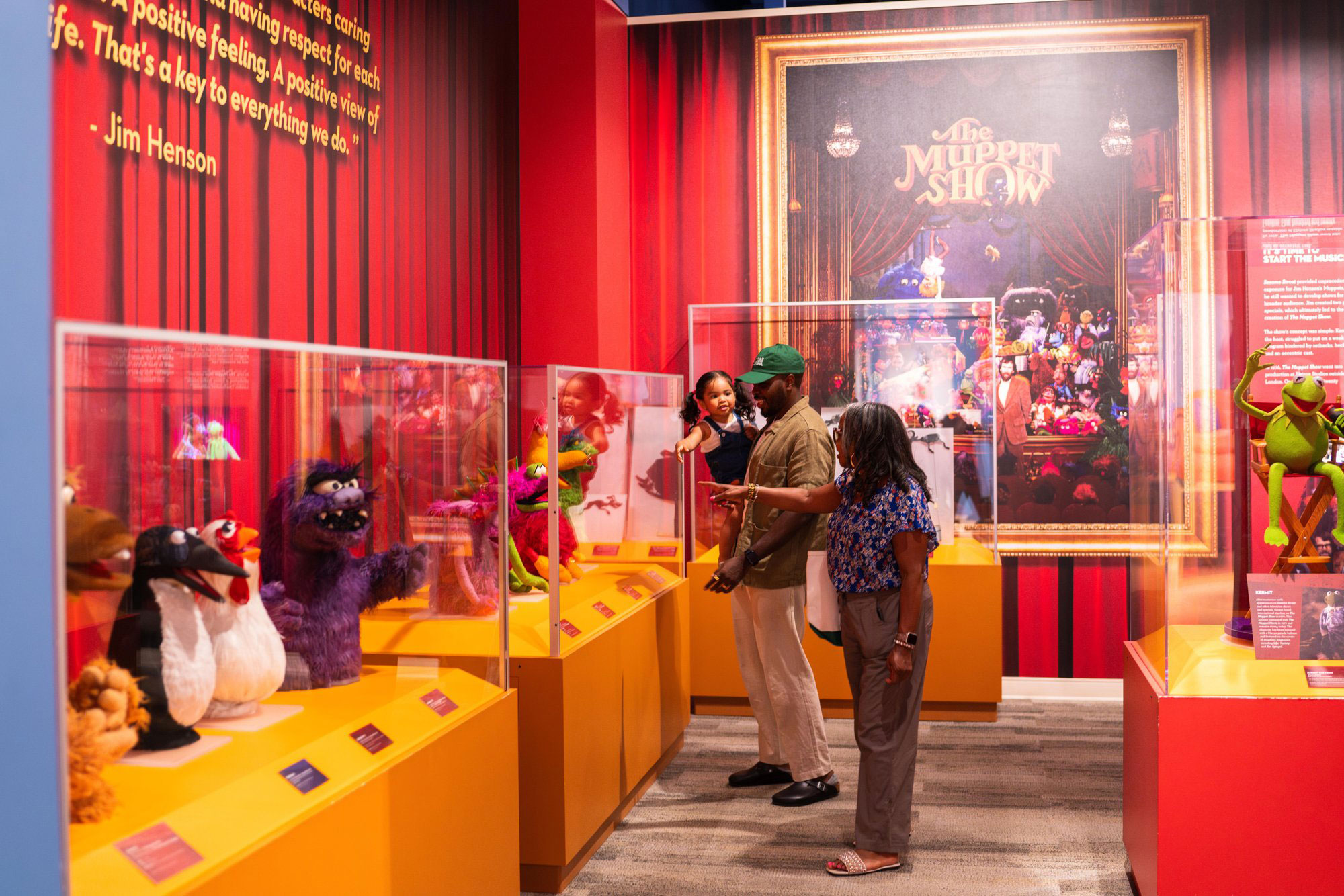 Family looking at famous Jim Henson puppets at the Center for Puppetry Arts in Atlanta, Georgia