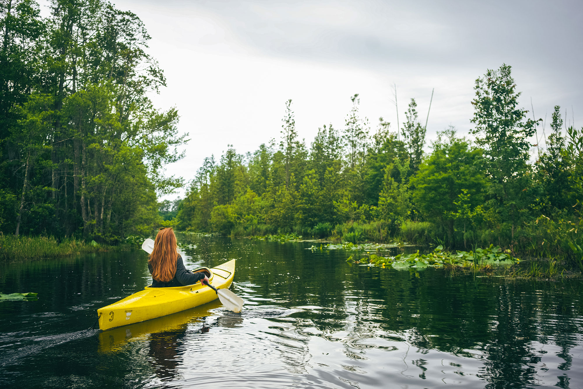 Woman kayaking in the Okefenokee Swamp. Photo by Wander North Georgia