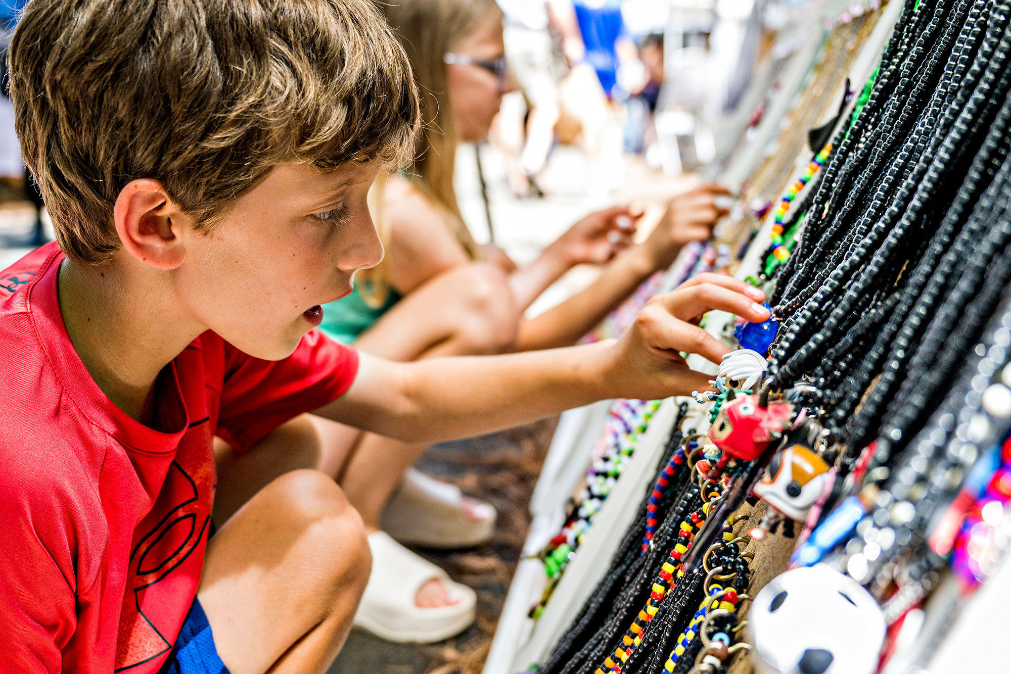 Kids looking at artwork at Alpharetta Arts Streetfest in Alpharetta, Georgia