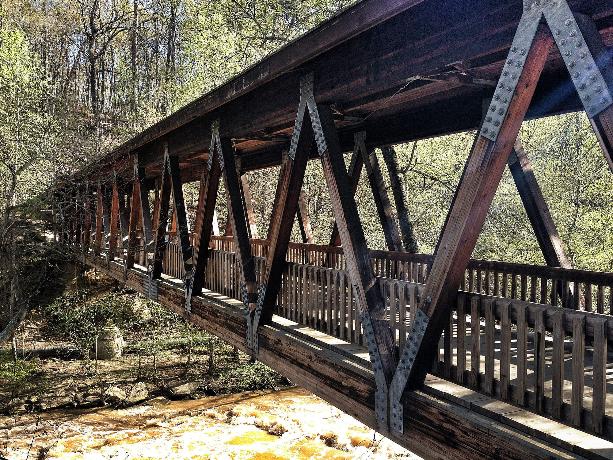 Covered pedestrian bridge at Old Mill Park in Roswell, Georgia