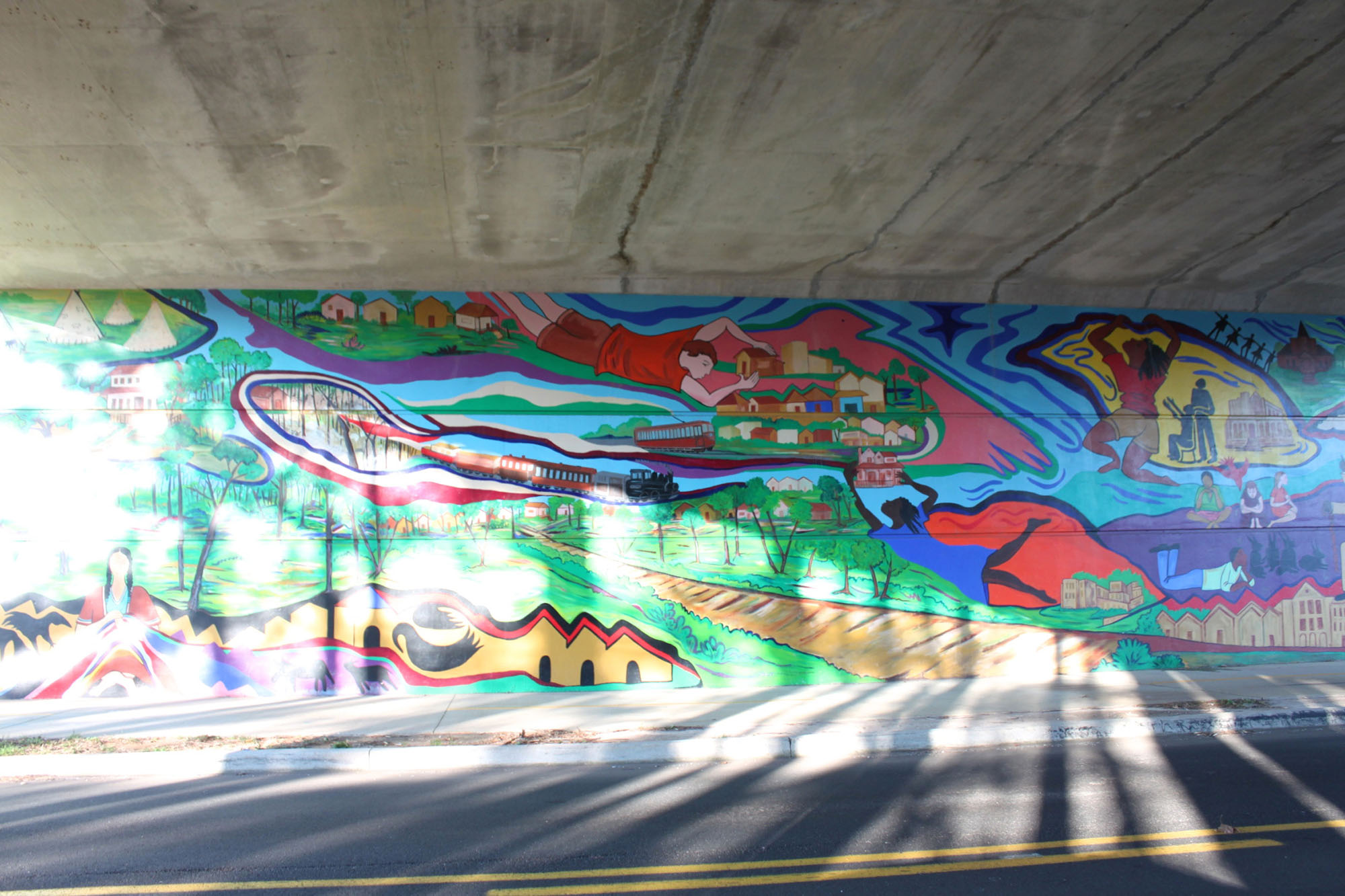 Mural by Malaika Favorite on the Atlanta BeltLine's West End Trail along White Street, underneath the Lawton Street bridge - Caroline Eubanks