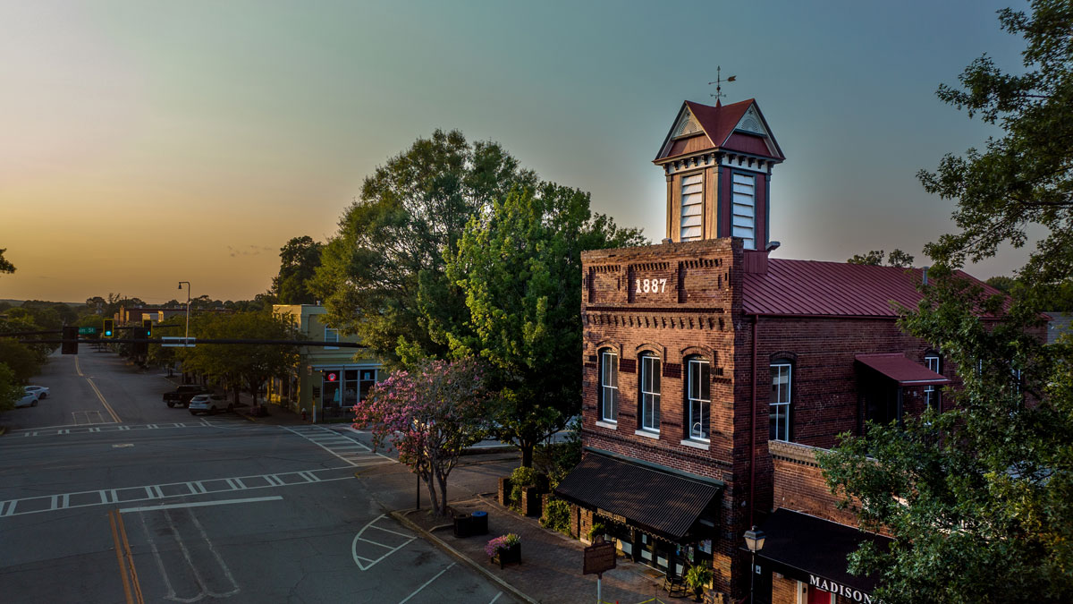 Outside of the Madison Morgan Welcome Center during sunrise at 