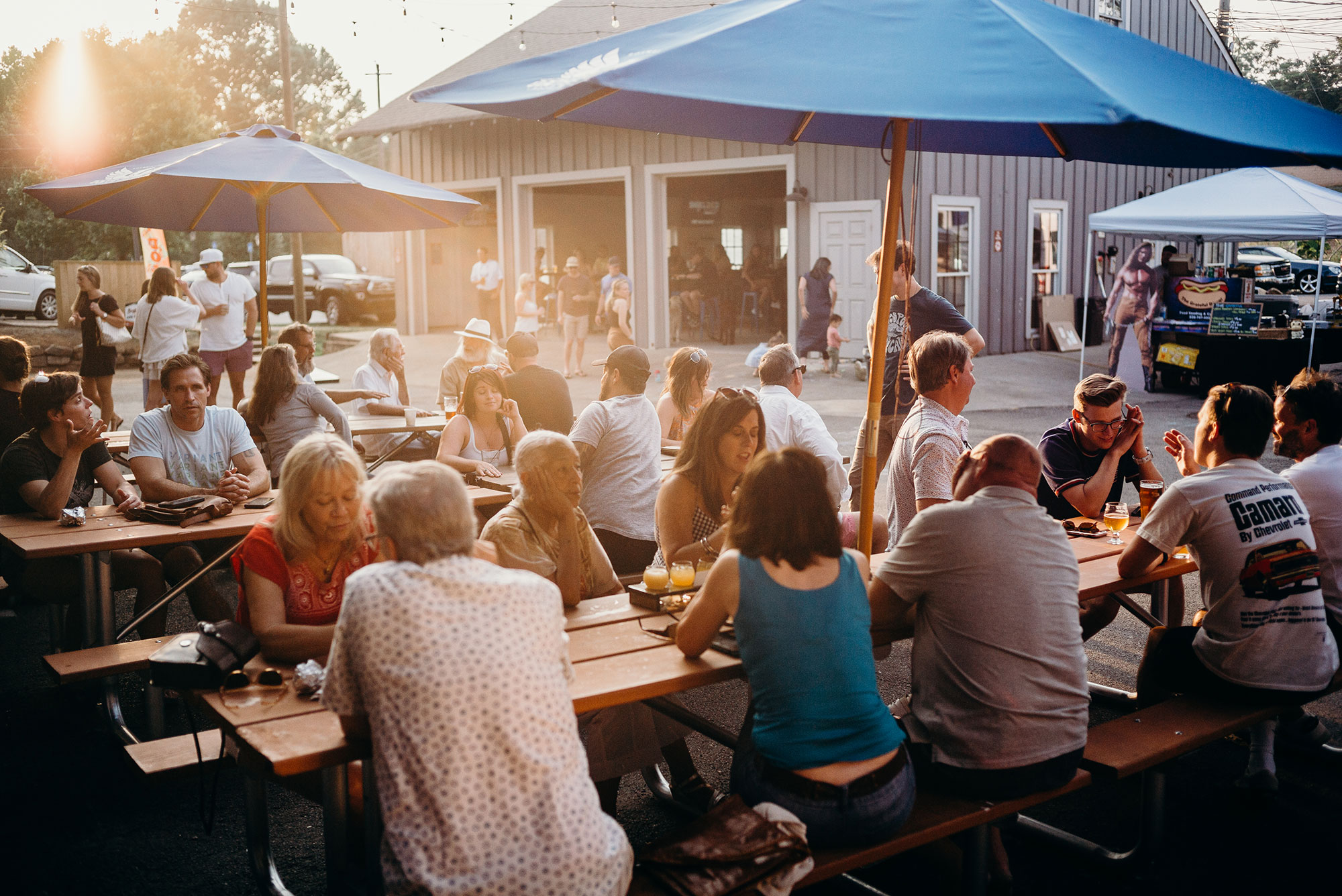 Patrons at outside tables at Gate City Brewing in Roswell, Georgia