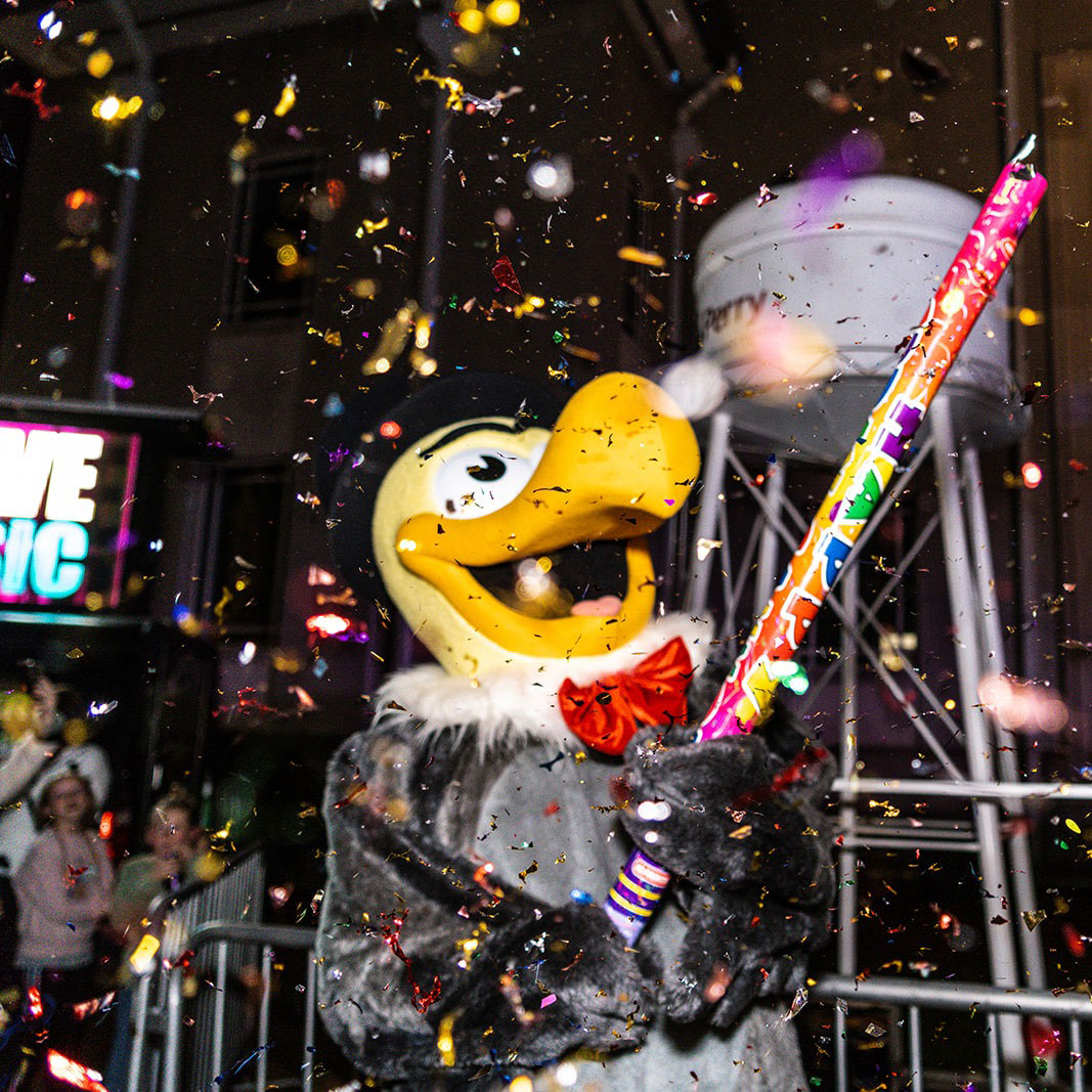Perry's buzzard mascot shooting off confetti on New Year's Eve