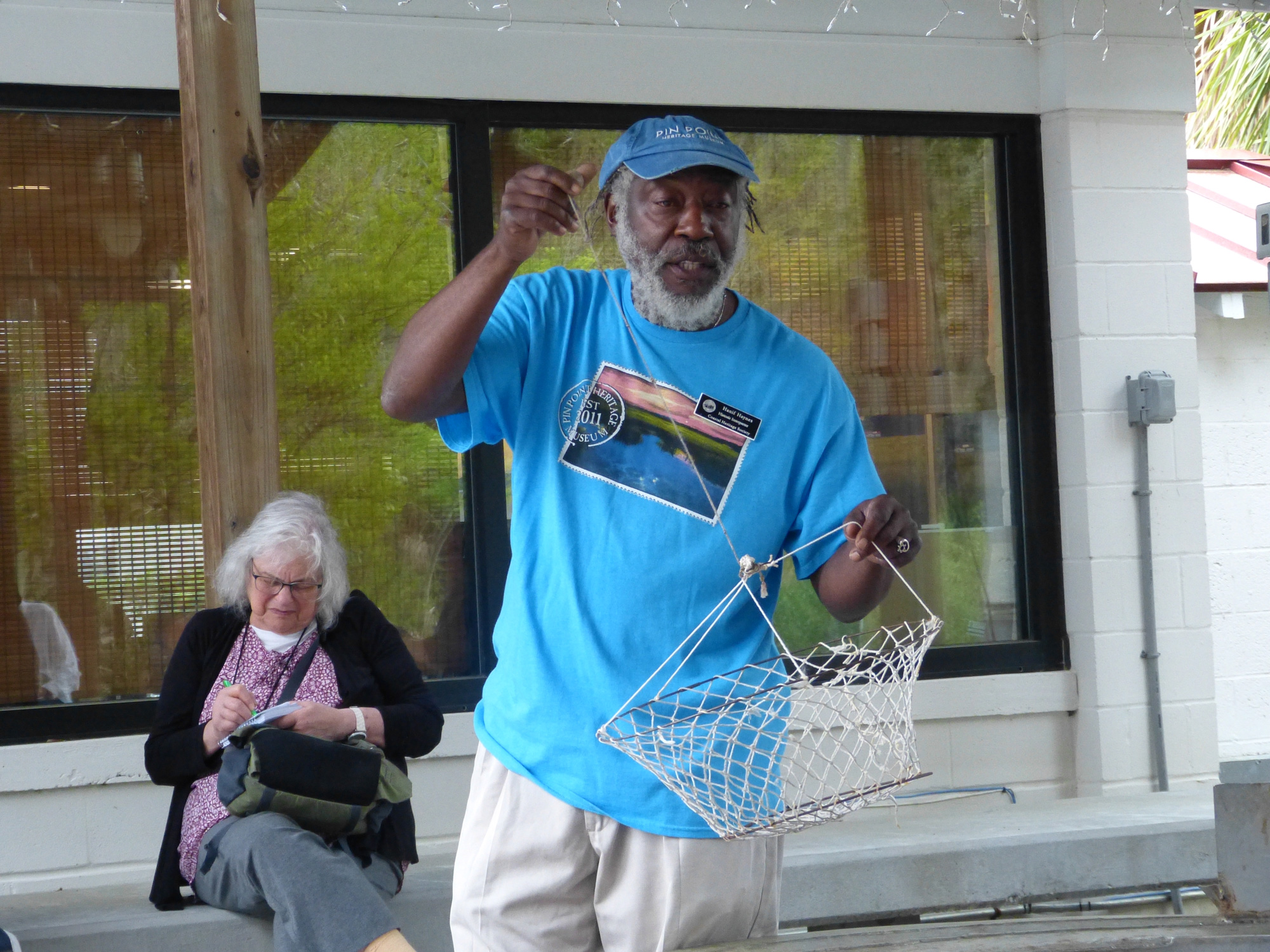 Herman Haynes shows how crabs were caught at the A.S. Varn & Son Oyster and Crab Factory. Photo by Kalin Thomas