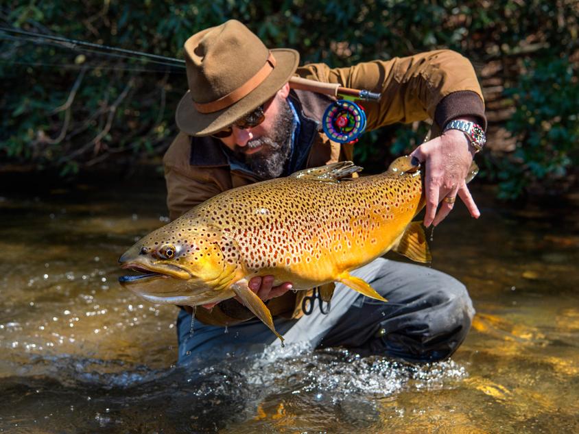 Will Taylor, fishing guide and owner of Fly Shop Co. of Blue Ridge, Georgia, shows off a trout. Photo by Jason Stemple