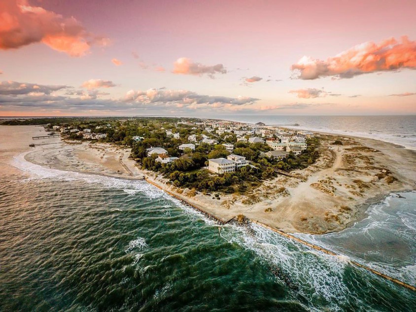 Aerial view of a town on an island surrounded by beaches.