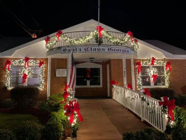 The city hall building in Santa Claus, Georgia, decorated with holiday lights