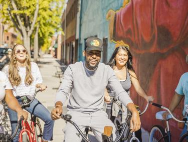 Five people riding bikes on a sunny day in Augusta, Georgia on the Bike Bike Baby Tour