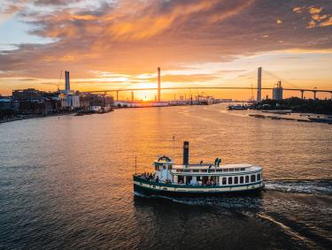 Sunset scene with riverboat in Savannah, Georgia