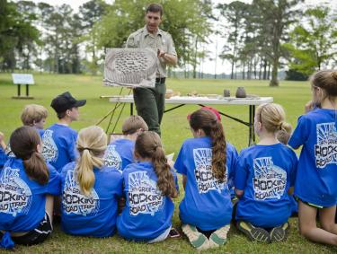 Ranger and kids at Kolomoki Mounds State Park in Blakely, Georgia