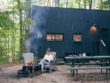 Reading outside a Postcard Cabin in Suches, Georgia