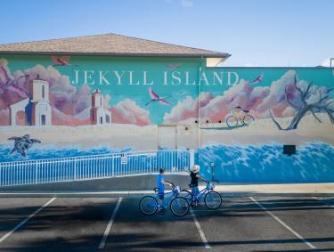 Cyclists near the Jekyll Island mural