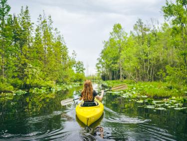 Woman kayaking in the Okefenokee Swamp. Photo by Wander North Georgia