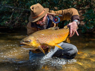 Will Taylor, fishing guide and owner of Fly Shop Co. of Blue Ridge, Georgia, shows off a trout. Photo by Jason Stemple