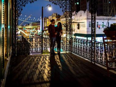 Couple on the balcony at The Marshall House in Savannah, Georgia