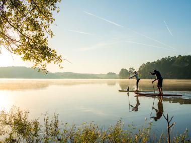 Two people padlleboarding in Acworth, Georgia