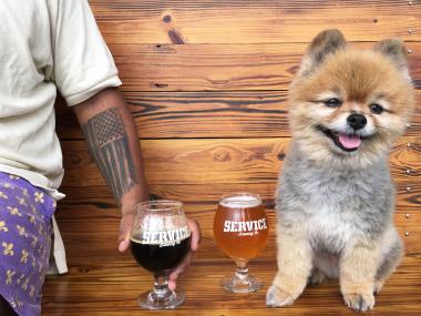 Dog and person with beers at Service Brewing Company in Savannah, Georgia