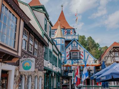 Colorful shops line the streets in a German-themed town in Georgia