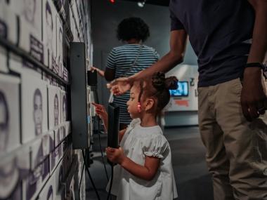Small girl and father at National Center for Civil and Human Rights in Atlanta, Georgia