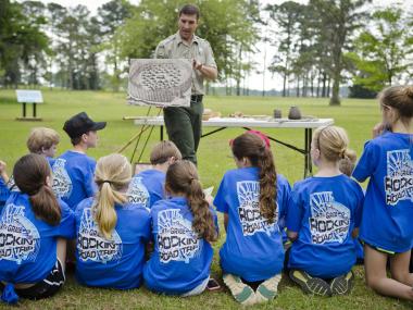 Ranger and kids at Kolomoki Mounds State Park in Blakely, Georgia