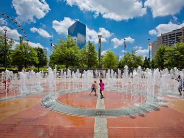 Children playing in the fountain of rings at Centennial Olympic Park in Atlanta, Georgia