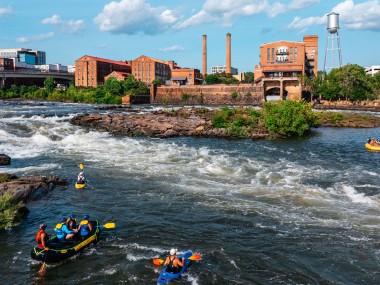 Rafters and kayakers on the river in Columbus, Georgia