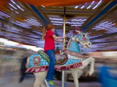 Girl on a carousel at Georgia National Fair in Perry, Georgia