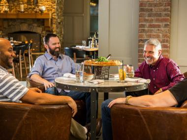 Four men dining at a Lake Oconee restaurant