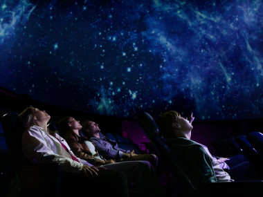 People watching a planetarium show at Tellus Science Museum in Cartersville, Georgia