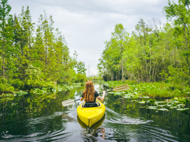 Woman kayaking in the Okefenokee Swamp. Photo by Wander North Georgia