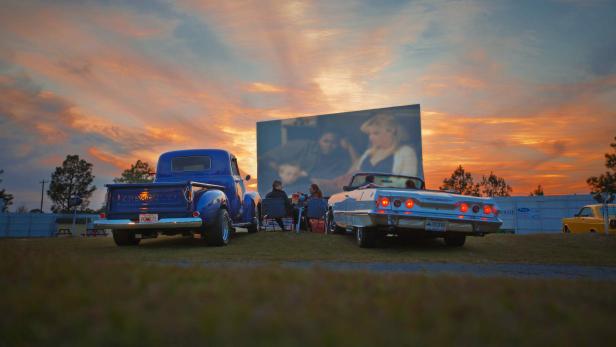 Two cars parked at the Jesup Drive-In in Jesup, Georgia