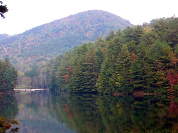 A lake with mountains in the background