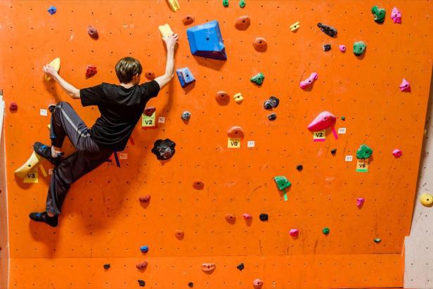 Person indoor rock climbing at Active Climbing in Augusta, Georgia