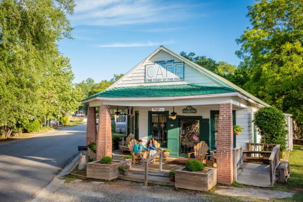 Photo by Ralph Daniel of a man and woman sitting on a porch at the Whistle Stop Cafe
