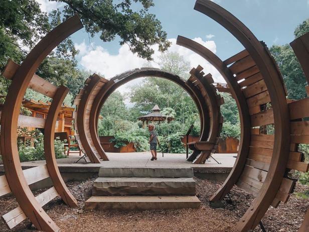 Child framed by a sculpture at the State Botanical Garden of Georgia in Athens, Georgia